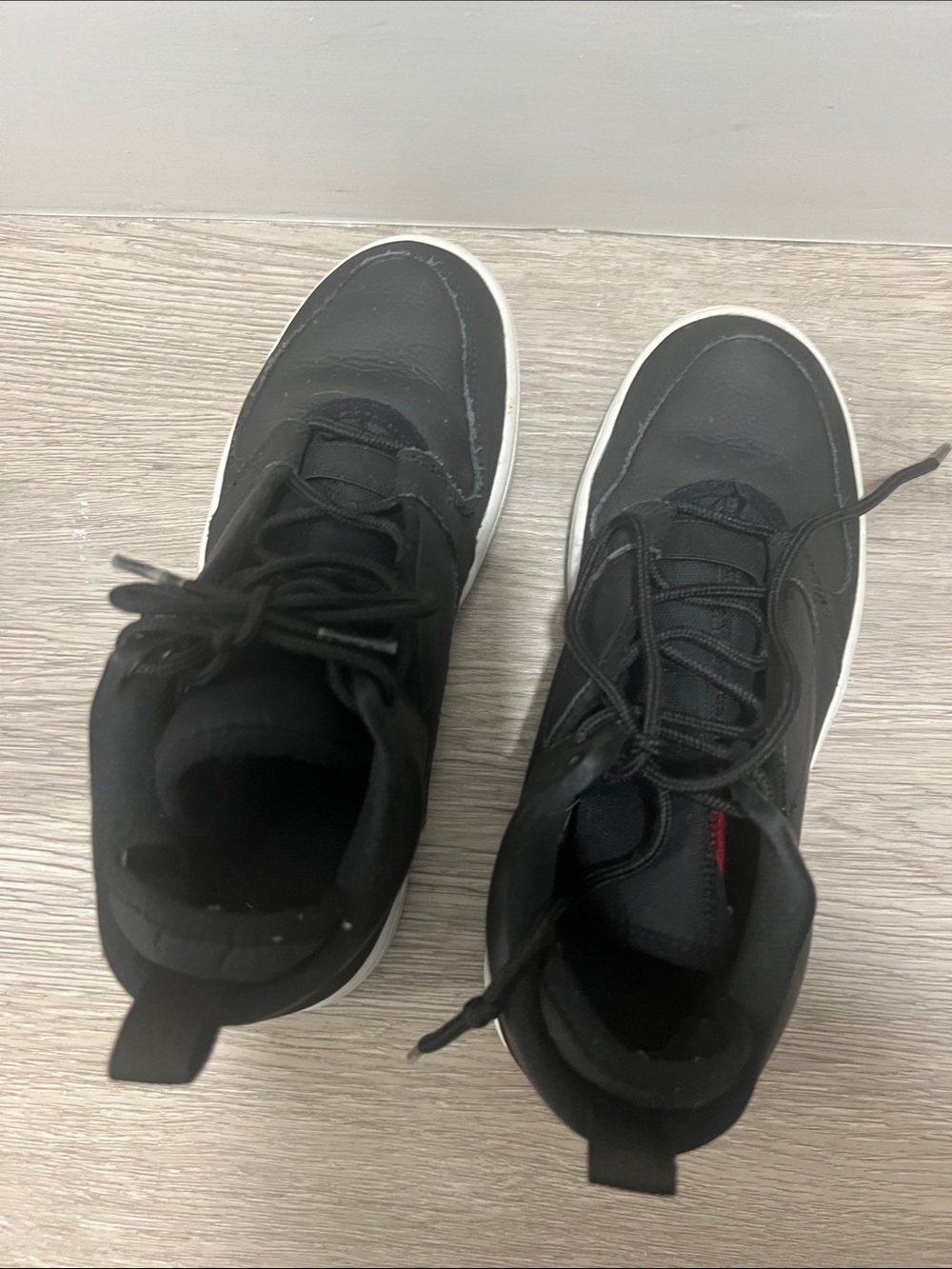 Jordan Kids Black High-Top Sneakers with White Sole and Red Tongue Accent